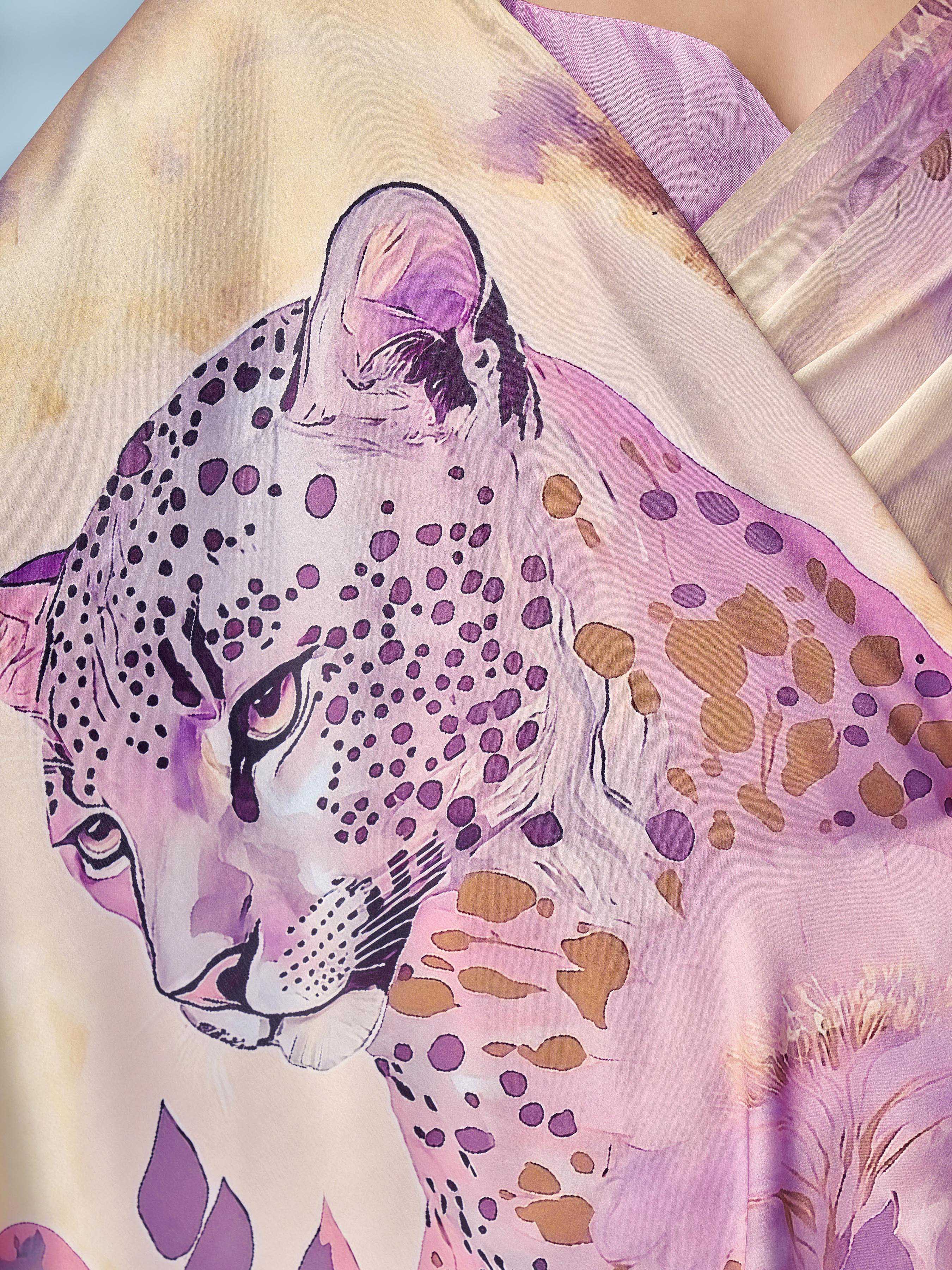 Cream colored designer animal print designer satin saree